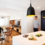 Sunny pops of yellow are found throughout this apartment interior