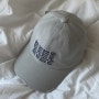 Matin Kim 마뗑킴 | lettering washed ball cap in light gray | 마뗑킴 모자, 레터링 그레이 모자