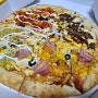 4가지 맛을 한번에 즐기는 피자