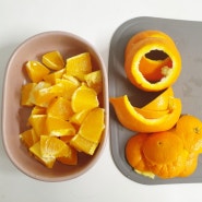 린클 음식물 처리기에 오렌지 껍질 버리기.