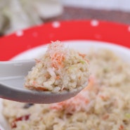 What does ganimiso risotto made with red crab paste taste like?